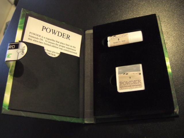 Two things inside a case, with a pamphlet to the left.